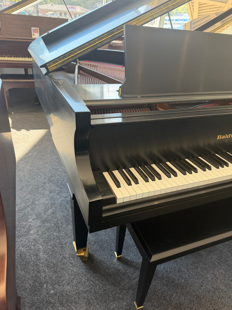 Baldwin model R grand Piano 5’8” in pristine condition. One owner like new.